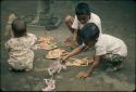 Children playing with paper puppets