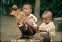 Children playing with paper puppets