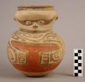 Pottery effigy jar, white base, red body and neck-neck broken