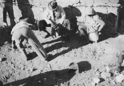 Three men playing a game, at Fritz Metzger's farm