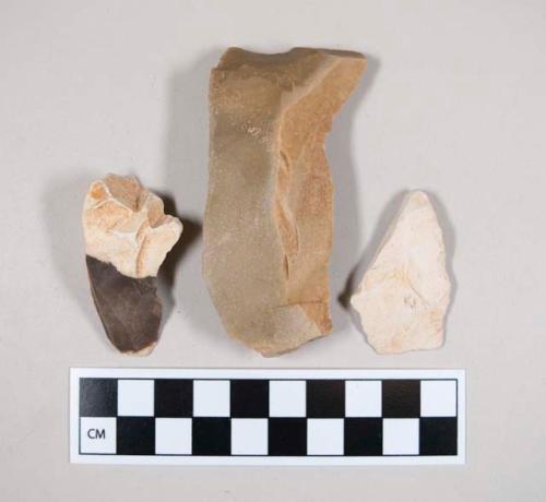Chipped stone, flakes?, tan, brown, white in color, with cortex, one specimen is all-white cortex