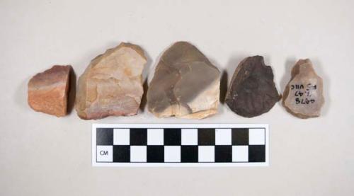 Chipped stone, scrapers?, flakes?, tan, gray, red, or brown in color, some cortex