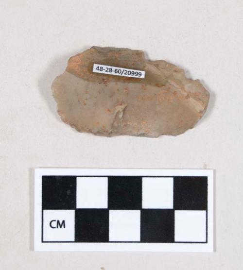 Chipped stone, flint edged tool, blade retouched on both edges, with possible serration