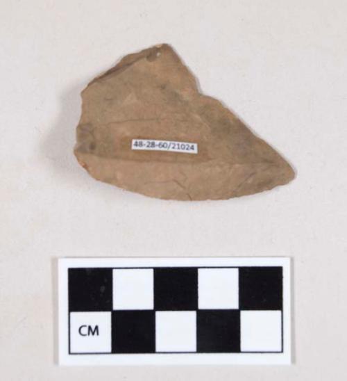 Chipped stone, flint flake, with possible retouching or use wear, with cortex