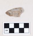 Chipped stone, flint uniface, with possible notch at one side of the base, possible projectile point