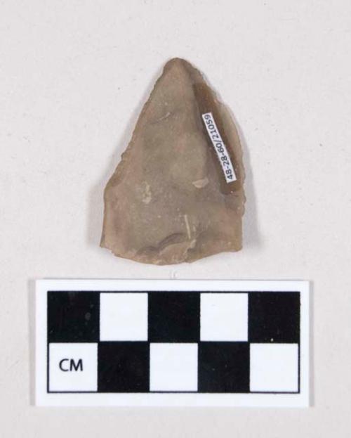 Chipped stone, flint flake, with possible retouching or use wear