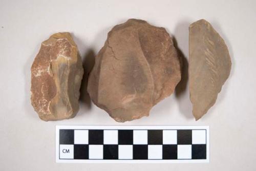 Chipped stone, flint scrapers, one with cortex