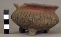 Vessel, with three legs.  Incised decoration.