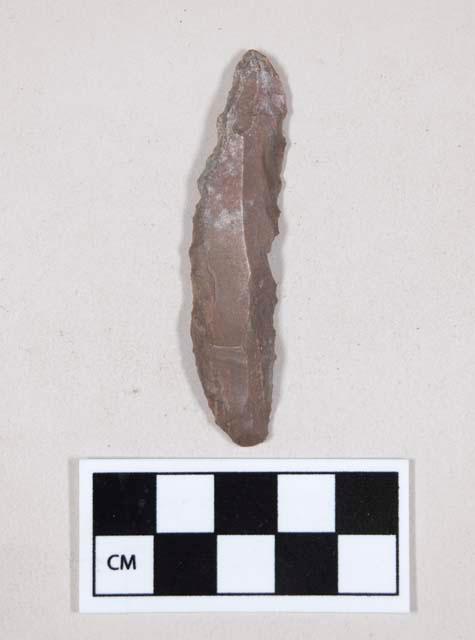 Chipped stone, flint uniface, possible serration