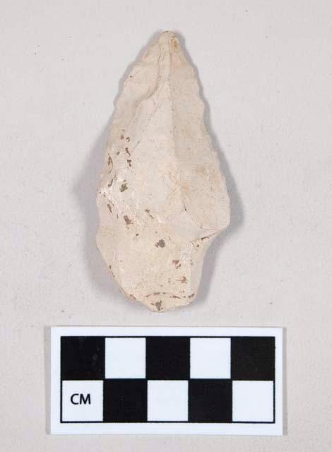 Chipped stone, flint uniface, with retouching, possible point