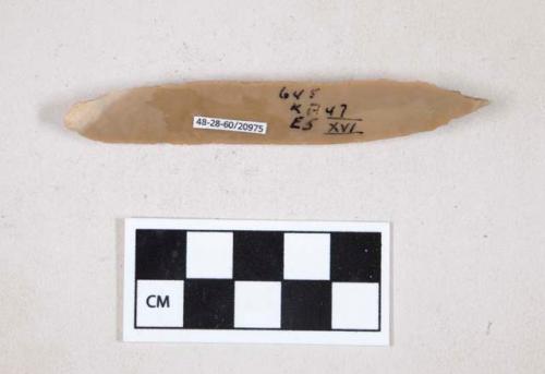 Chipped stone, flint uniface, blade worked into a point at one end