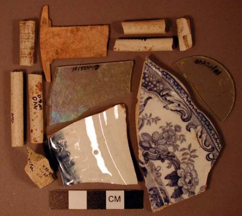 Ceramic pipe & plate fragments, glass fragments, bone comb fragment