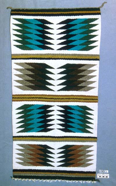 Gallup throw or rug, four bands each with two figures of stacked lozenges