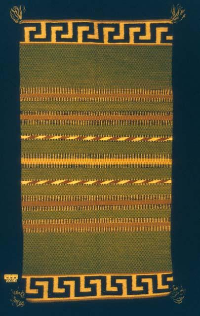 Saddle blanket or rug with meander fret