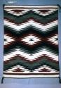 Rug with Ganado colors, concentric diamonds and zigzag bands