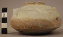 Small, narrow mouthed pottery urn - tan and white mottled ware; 2 looped handles
