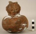 One pottery effigy jar, orange ware