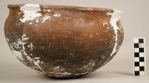 Restored pottery vessel and 4 unrelated sherds