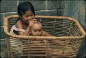 Children sitting in basket