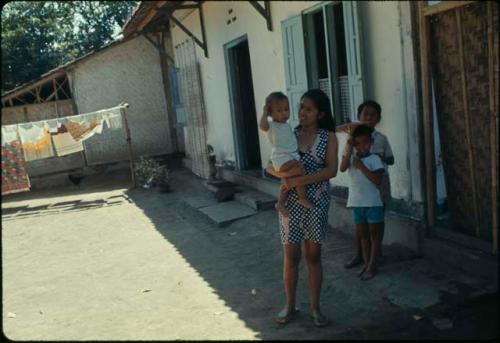 Family in front of house