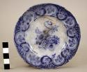 Blue china dish, restored; 4 3/4" in diameter; flowered & transfer design