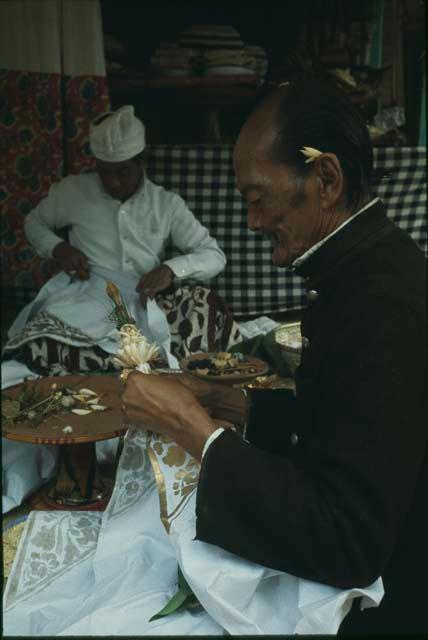 Priest officiating at Pengastian ceremony