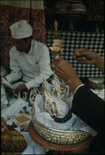 Priest officiating at Pengastian ceremony