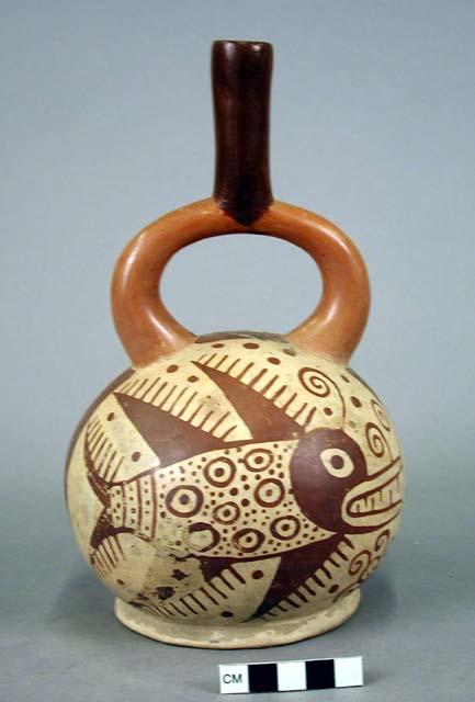 Ceramic bottle, stirrup spout, red on cream zoomorphic (fish) design