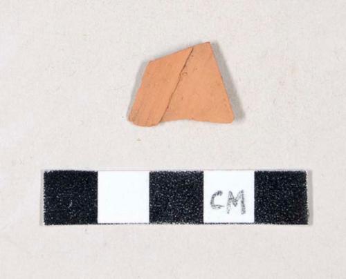 Unglazed, undecorated and molded redware body sherd