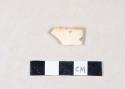 Orange lusterware body sherd