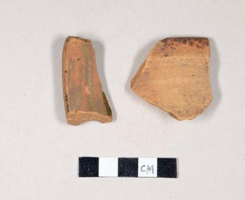 Glazed and undecorated redware rim sherds, one is cross two sherds cross mended