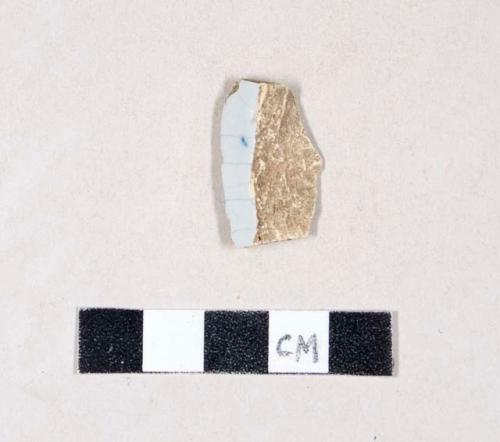 Tin glazed earthenware body sherd, possible blue hand painted decoration