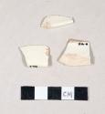 Undecorated creamware rim sherds; three sherds crossmend