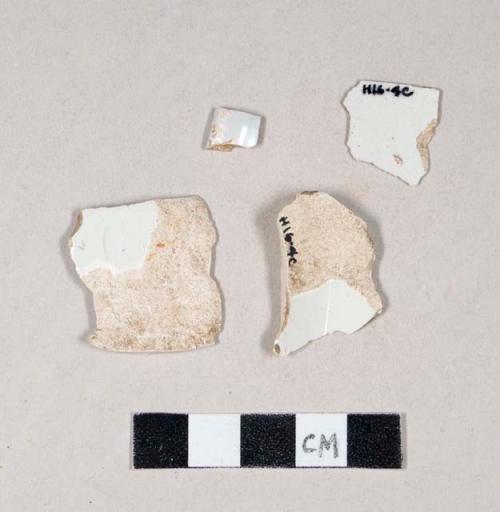 Undecorated pearlware body sherds; two sherds crossmend