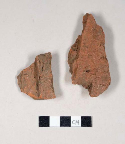 Redware roof tile fragments, one has nail hole