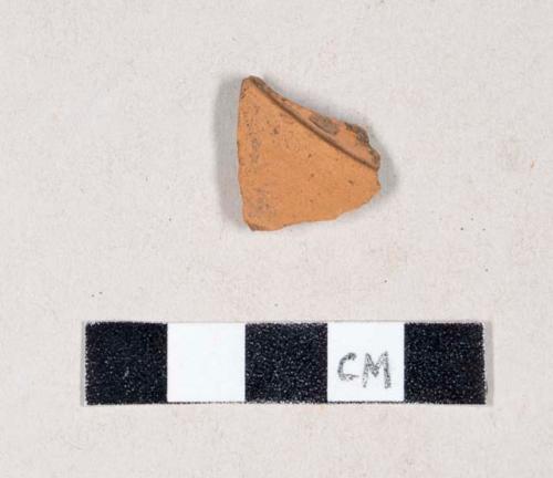 Unglazed, undecorated redware body sherd, likely flowerpot