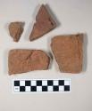 Redware roof tile fragments, one with nail hole