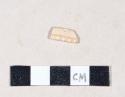 Creamware rim sherd with molded, possibly rouletted, design around rim