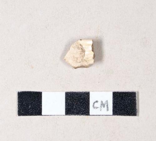 Undecorated creamware body sherd, with attached molded handle