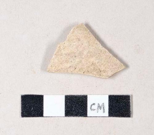 Unglazed, undecorated buff-bodied earthenware body sherd