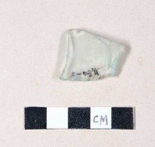 Aqua bottle glass fragment, embossed with unidentified partial letter