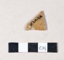 Buff bodied, brown glazed stoneware body sherd