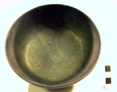 Black bowl with black designs