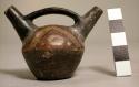 Miniature polychrome pottery vessel- double spout with bridge