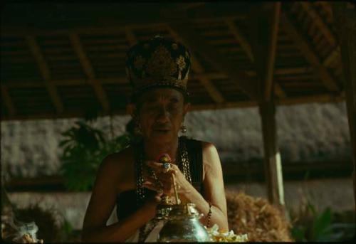 Priest officiating at Naga Banda ceremony