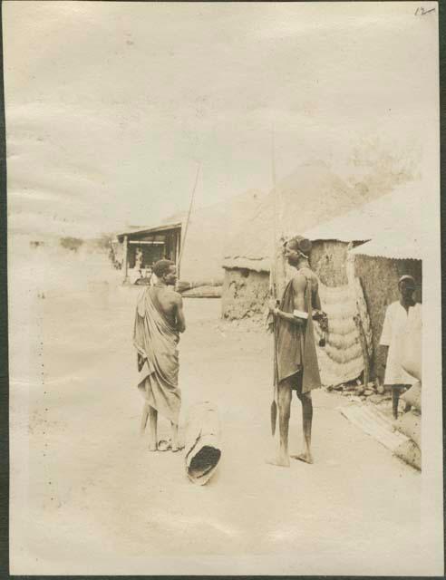 Shilluk warriors in a village along the Nile River