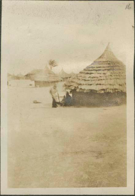 Corner of village showing flounced roof huts, near the Nile River