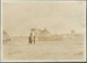 Women carrying baskets on their heads, village of the scrubby bush and grassland