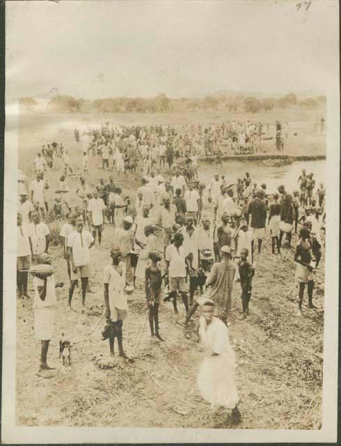 South from Mongalla to Rejaf, view of large crowd standing ashore the Nile River