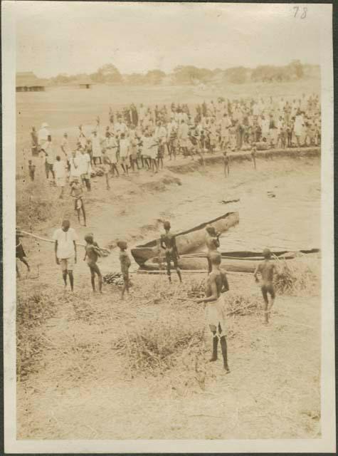 South from Mongalla to Rejaf, view of large crowd standing ashore the Nile River